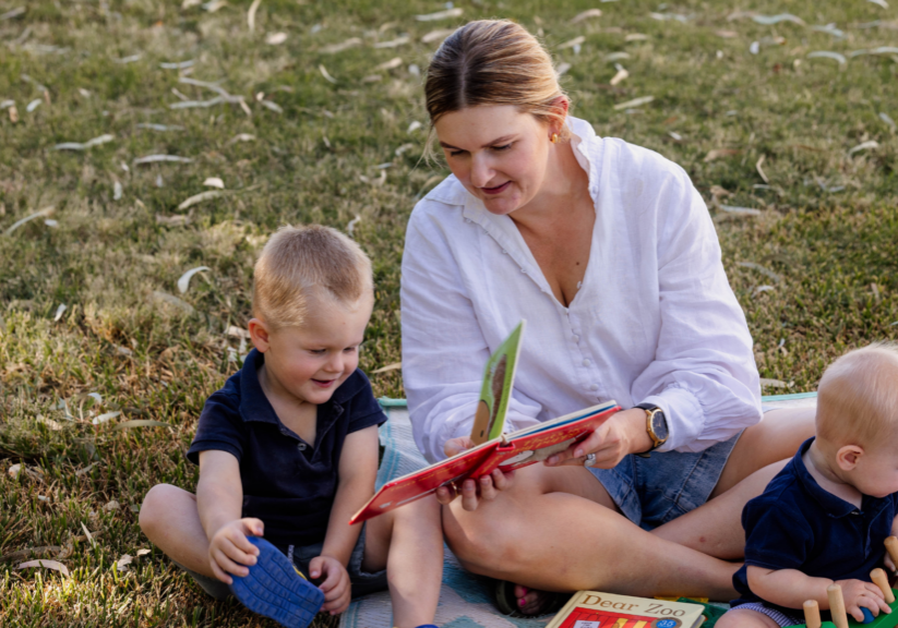  Parent and young child engaging in conversation while learning communication and language skills.