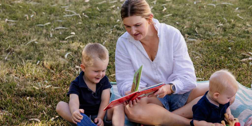  Parent and young child engaging in conversation while learning communication and language skills.